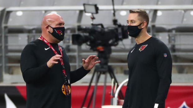 Arizona Cardinals general manager Steve Keim (left) talks with head coach Kliff Kingsbury during Red & White Practice at Stare Farm Stadium.